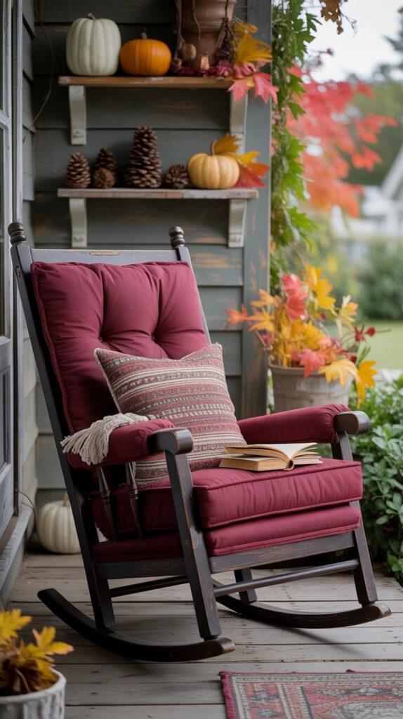 A rocking chair on a porch with a decor stand with your favorite fall things displayed